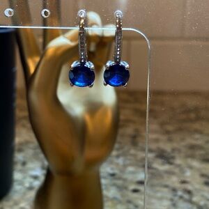 Marked 925 and white rhinestone lever back blue spinel earrings.